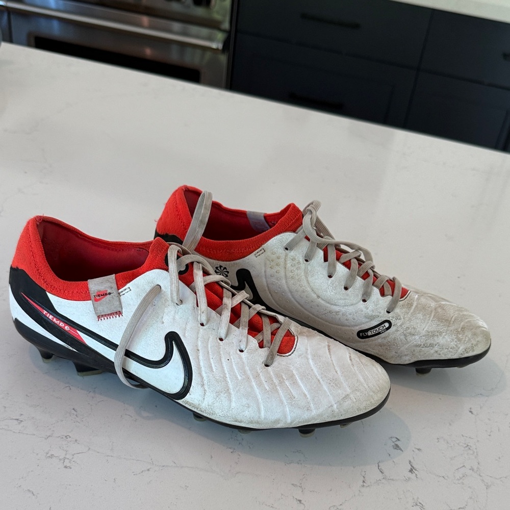 Nike Tiempo and bright red/orange and white soccer cleats